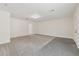 Bonus room with updated flooring, trim detail, and ample lighting at 3690 Basswood Rd, Snellville, GA 30039