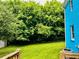 Backyard view showcasing vibrant green foliage and the home's exterior at 5560 Old Bill Cook Rd, College Park, GA 30349