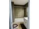 Bathroom with a tiled shower and gray cabinets at 5560 Old Bill Cook Rd, College Park, GA 30349