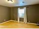 Clean bedroom featuring light colored wood floors, neutral walls, and natural light at 5560 Old Bill Cook Rd, College Park, GA 30349