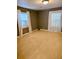Bright bedroom with large windows and plush carpeting for cozy comfort at 5560 Old Bill Cook Rd, College Park, GA 30349