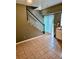 Entryway with staircase, tiled floor, and sliding glass door with backyard view at 5560 Old Bill Cook Rd, College Park, GA 30349
