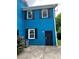 Close-up of home’s exterior showing its painted brick and dark shutters at 5560 Old Bill Cook Rd, College Park, GA 30349