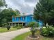 Charming two-story home with a welcoming front porch and well-manicured landscaping at 5560 Old Bill Cook Rd, College Park, GA 30349