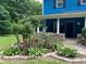 Attractive porch featuring well-manicured landscaping and a stone accent at 5560 Old Bill Cook Rd, College Park, GA 30349