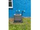 Exterior shot of Rheem HVAC unit outside of house with blue brick exterior and window at 5560 Old Bill Cook Rd, College Park, GA 30349