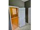 Neutral hallway showcasing flooring and a door leading to another room at 5560 Old Bill Cook Rd, College Park, GA 30349