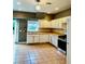 A spacious kitchen with stainless steel appliances, and access to outdoor area at 5560 Old Bill Cook Rd, College Park, GA 30349