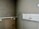 Laundry room featuring white cabinets and open shelving, ready for personalization at 5560 Old Bill Cook Rd, College Park, GA 30349