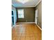 Neutral living room featuring tile flooring, a window for natural light, and fresh paint at 5560 Old Bill Cook Rd, College Park, GA 30349