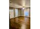 Bright living room with hardwood floors, large windows, and a ceiling fan for comfort at 5560 Old Bill Cook Rd, College Park, GA 30349