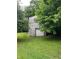 Exterior view of a detached outbuilding with a garage door at 5560 Old Bill Cook Rd, College Park, GA 30349