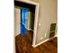 A room with hardwood floors and gray walls is visible through a doorway at 5560 Old Bill Cook Rd, College Park, GA 30349
