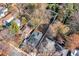An aerial view showcases the house and the property's borders in a neighborhood with fall foliage at 944 Woodland Ave, Atlanta, GA 30316
