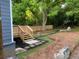 Backyard with steps down from deck, features a stone garden path, and lush greenery at 944 Woodland Ave, Atlanta, GA 30316