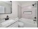 Updated bathroom with granite vanity, subway tile shower, and modern fixtures at 944 Woodland Ave, Atlanta, GA 30316