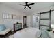 Bright bedroom features stylish decor, wood-look floors, and a decorative sliding barn door at 944 Woodland Ave, Atlanta, GA 30316