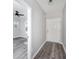 Light and airy foyer featuring gray walls and modern gray hardwood flooring at 944 Woodland Ave, Atlanta, GA 30316