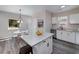 Bright kitchen featuring granite counters and island with a dining area near a window at 944 Woodland Ave, Atlanta, GA 30316