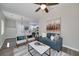 Bright living room with modern decor, stylish seating, and ceiling fan for comfortable living at 944 Woodland Ave, Atlanta, GA 30316