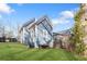 Charming home with blue siding, green lawn, bench and a deck overlooking the backyard at 1087 Longley Nw Ave, Atlanta, GA 30318