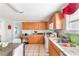 Functional kitchen with light wood cabinets, granite countertops, and tiled flooring at 1091 Longley Nw Ave, Atlanta, GA 30318