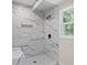 Modern bathroom featuring a tile shower with sleek black fixtures and a built-in shelf at 2158 Huckleberry Ln, Lithia Springs, GA 30122