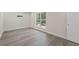 Bright and airy bedroom with large window and modern vinyl plank flooring at 2158 Huckleberry Ln, Lithia Springs, GA 30122