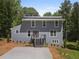 Charming two-story home with a modern metal roof and a freshly poured concrete driveway at 2158 Huckleberry Ln, Lithia Springs, GA 30122