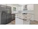Bright kitchen featuring stainless steel appliances, granite countertops, and white cabinetry at 2158 Huckleberry Ln, Lithia Springs, GA 30122