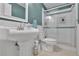 This bathroom offers white tiled shower, beadboard, and a stylish pedestal sink at 305 River Glen Dr, Roswell, GA 30075