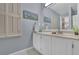 This bathroom features a single sink vanity, neutral color walls, and art hanging above the sink at 305 River Glen Dr, Roswell, GA 30075