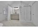 Modern bathroom with dual vanities, walk-in shower, and sleek finishes at 305 River Glen Dr, Roswell, GA 30075
