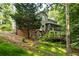 View of the backyard of this home featuring a screened porch and deck at 3453 Drayton Ne Dr, Roswell, GA 30075
