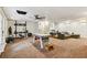 Finished basement with pool table, workout equipment and comfortable seating area at 3453 Drayton Ne Dr, Roswell, GA 30075
