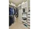 Walk-in closet with custom shelving providing ample storage space and organization at 3453 Drayton Ne Dr, Roswell, GA 30075