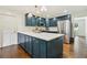 Stylish kitchen with island, stainless steel appliances, and abundant cabinet space at 3453 Drayton Ne Dr, Roswell, GA 30075