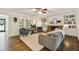 Open living space with fireplace, built-in bookshelves, and seamless access to a sitting area at 3453 Drayton Ne Dr, Roswell, GA 30075