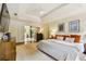 Stylish main bedroom boasts a tray ceiling, ensuite access, and ample natural light at 3453 Drayton Ne Dr, Roswell, GA 30075