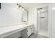 Bathroom with a large vanity and tub with shower at 123 Maison Nw Pl, Atlanta, GA 30327