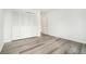 Bedroom featuring wood floors and closet with louvered doors at 123 Maison Nw Pl, Atlanta, GA 30327