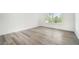 Bright bedroom with hard wood flooring and a large window at 123 Maison Nw Pl, Atlanta, GA 30327