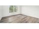 Bedroom with light wood flooring and a large window at 123 Maison Nw Pl, Atlanta, GA 30327
