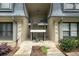 A welcoming building entrance showcases the access to individual units, enhanced by carefully selected greenery at 123 Maison Nw Pl, Atlanta, GA 30327