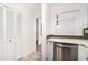 Updated kitchen with stainless dishwasher and open passthrough for easy entertaining, combining style with functionality at 123 Maison Nw Pl, Atlanta, GA 30327