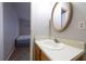 Small bathroom with white sink and access to bedroom at 1406 Springleaf Se Cir, Smyrna, GA 30080