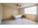 Neutral bedroom featuring a queen bed, a ceiling fan, and large window at 1406 Springleaf Se Cir, Smyrna, GA 30080