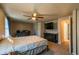 Neutral bedroom featuring a ceiling fan, tv and access to an attached bathroom at 1406 Springleaf Se Cir, Smyrna, GA 30080