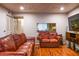Living room with hardwood floors, and a view to the kitchen at 1406 Springleaf Se Cir, Smyrna, GA 30080