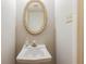 Stylish powder room featuring decorative mirror, single sink and modern faucet at 1406 Springleaf Se Cir, Smyrna, GA 30080